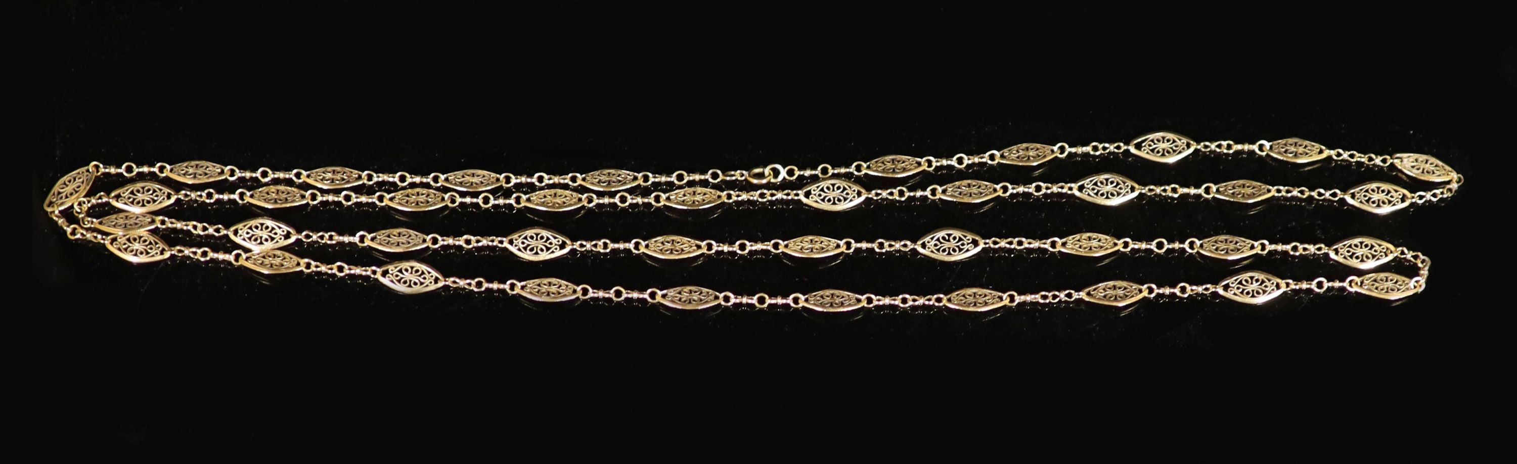 An early 20th century French 18ct gold, pierced navette shaped fancy link long necklace.